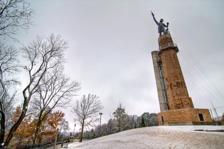 an image of a monument with a statue in the background