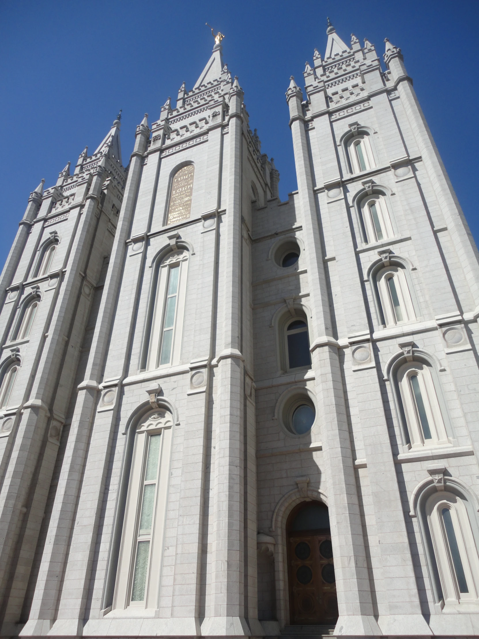 a tall church building towering over a city