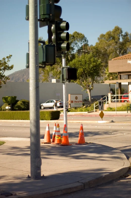 a traffic light sitting on the side of a road