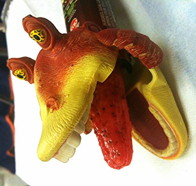 a close up view of a plastic dragon head