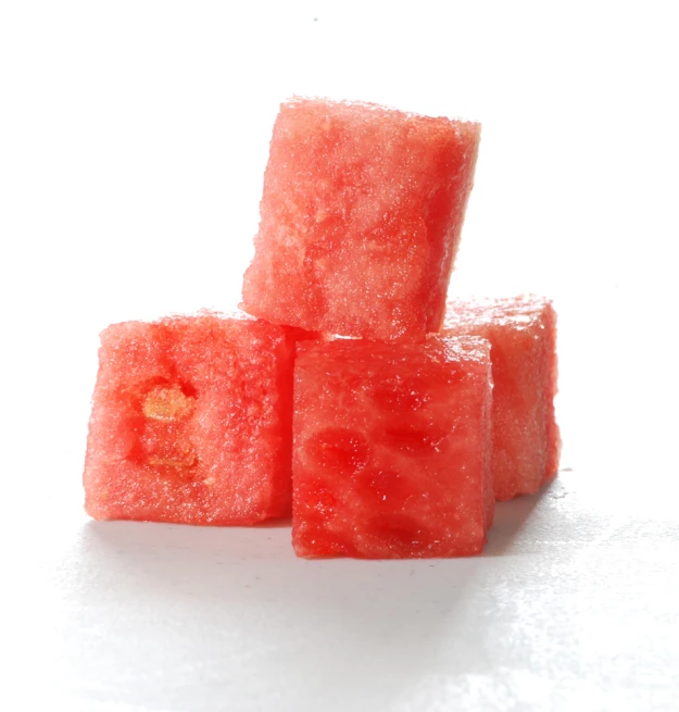some pieces of watermelon sitting on top of each other