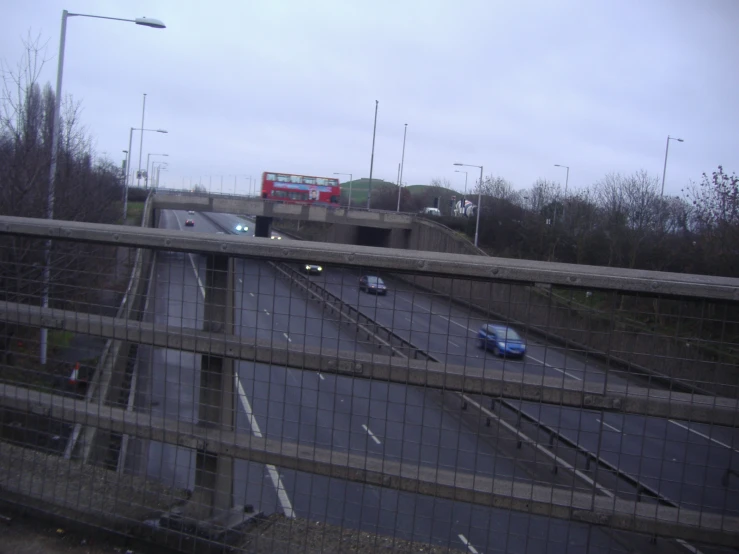 a truck on an overpass with lots of traffic