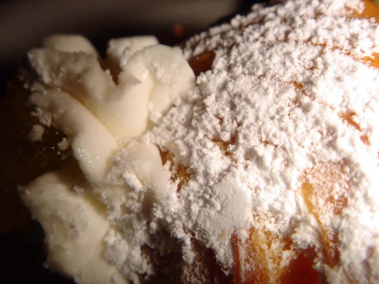 powdered sugar is in the top of a pastry