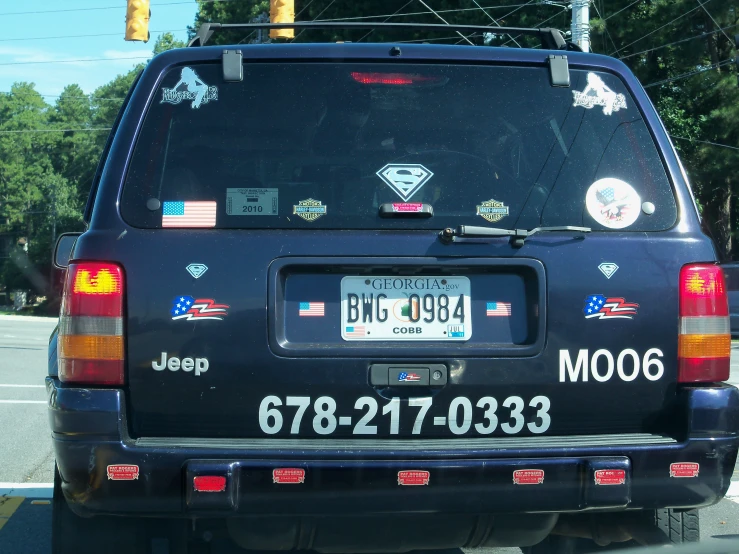 the back end of an suv parked on the street