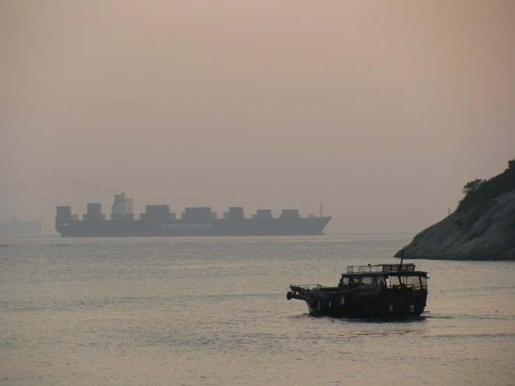 a boat with cargo on it drives across the water