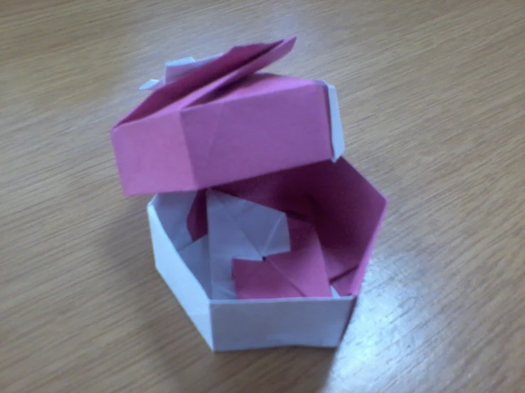 a opened box sitting on top of a wooden table