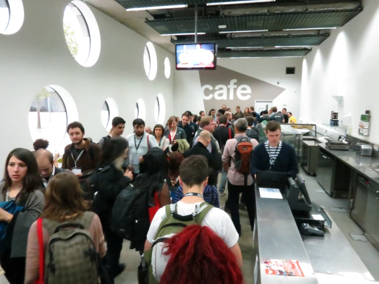 a large group of people waiting in line