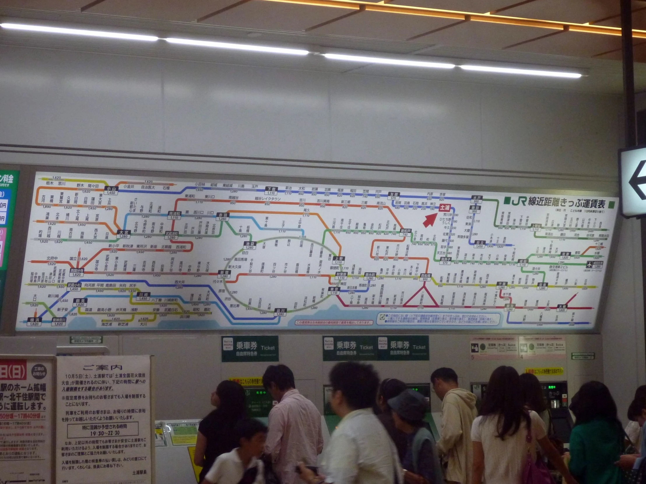 a subway map hanging over the subway wall