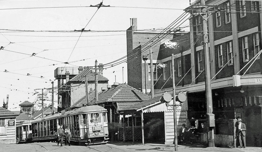 an old time scene with two trains on tracks