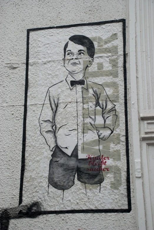 a painting on a white wall shows a man in shorts, tie and shirt