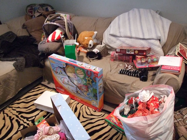 a bunch of stuffed animals and toys are on the living room floor