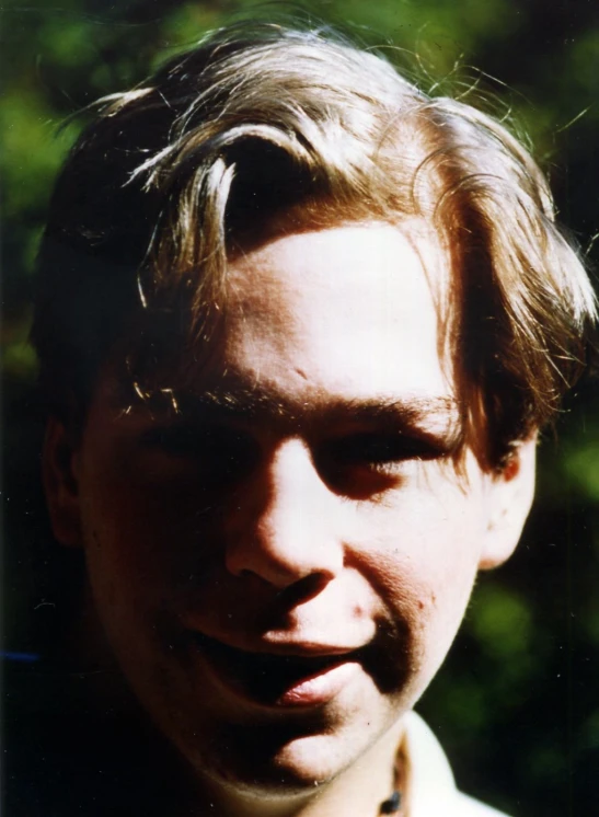 a close up of a person wearing an animal print shirt