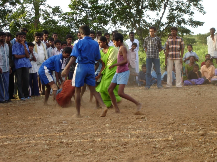 several people watch as people try to avoid them from walking