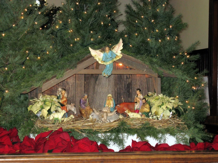 christmas scene of nativity scene with doves and other figurines