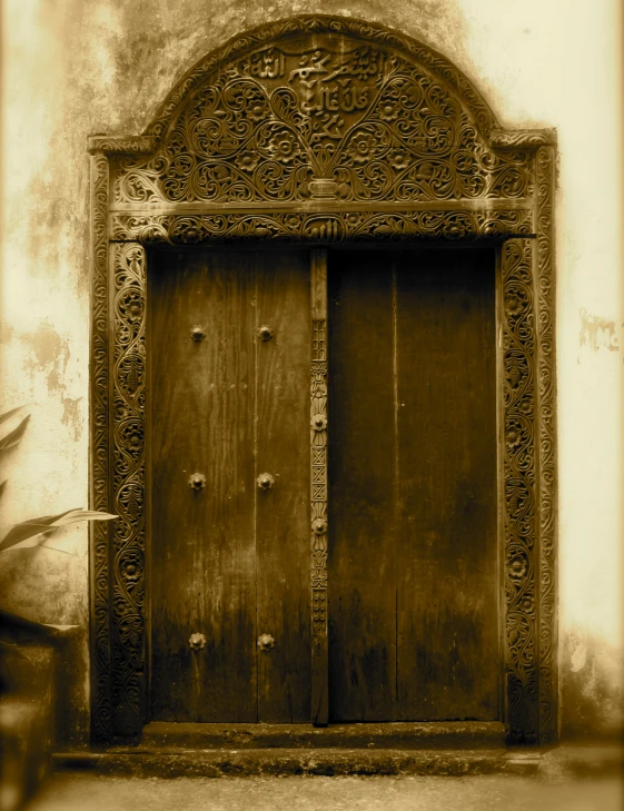 two old door to another building with a wooden front