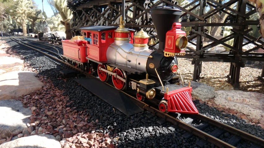 a toy train is shown on the tracks