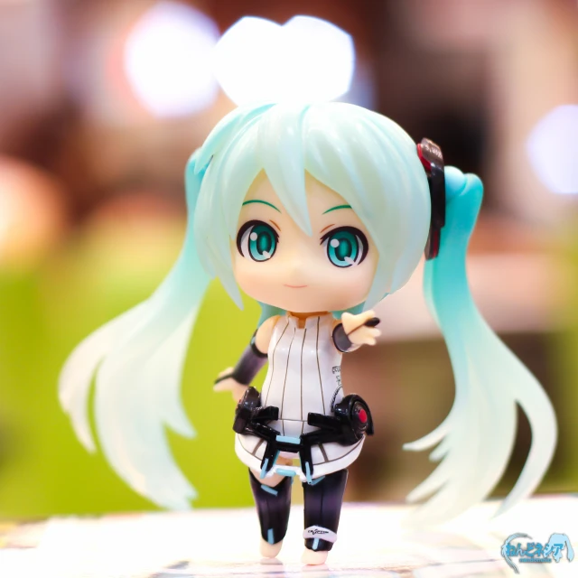 a cute anime character figurine with blue hair and boots