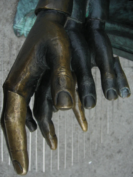 a ss colored hands with rings on the thumb and fingers