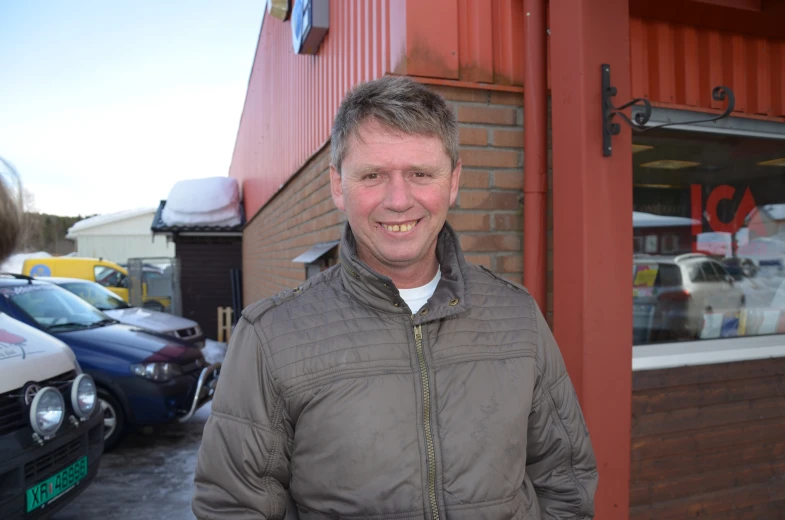 a man standing in front of a store