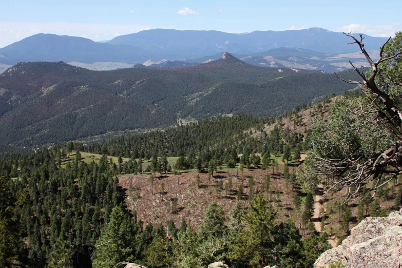 a very big view of some mountains and the valley