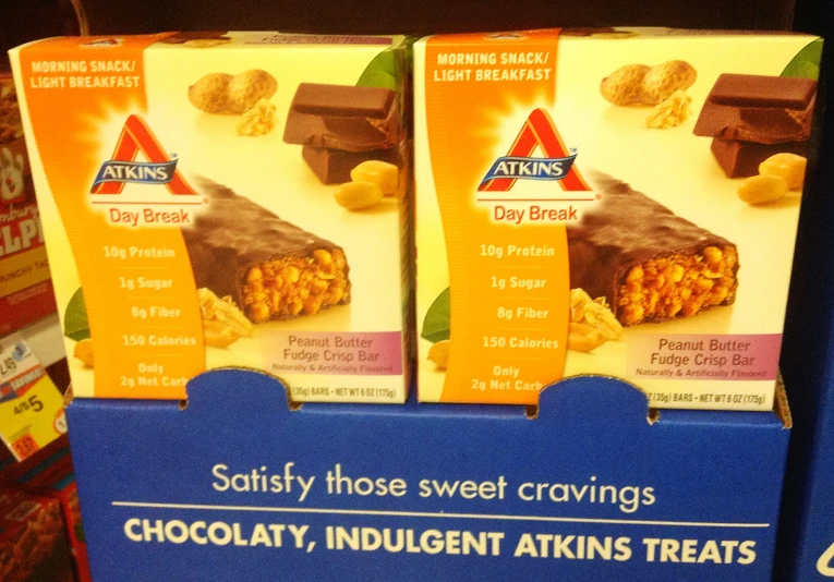 three boxes of bars are on display in a store