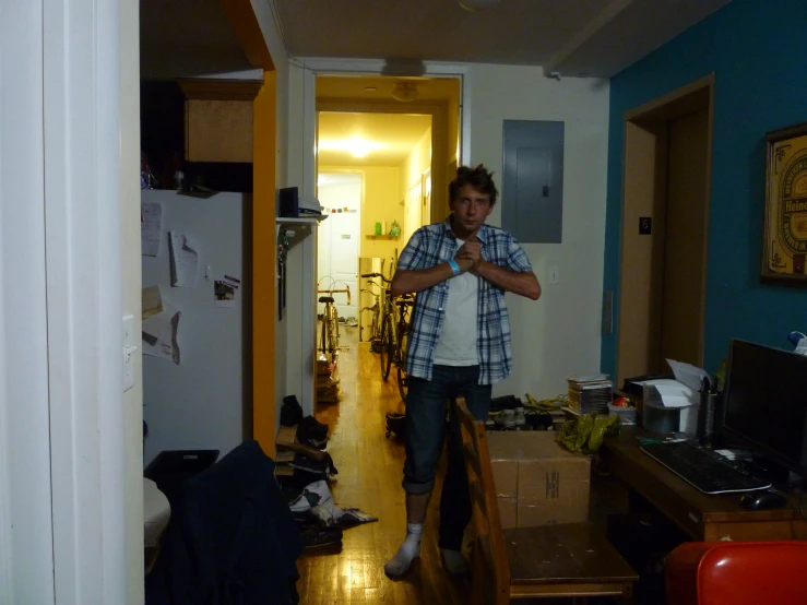 a man standing in a room with a table