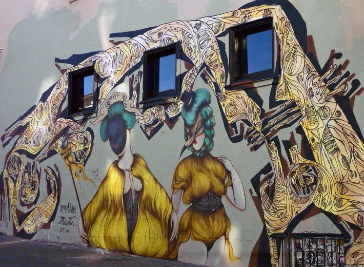 some paintings on the side of a building