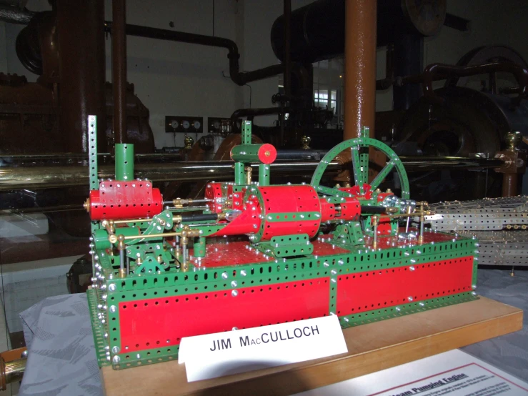 a lego sculpture with red, green and white equipment