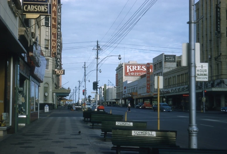 street scene with signs for shoes and footwear stores