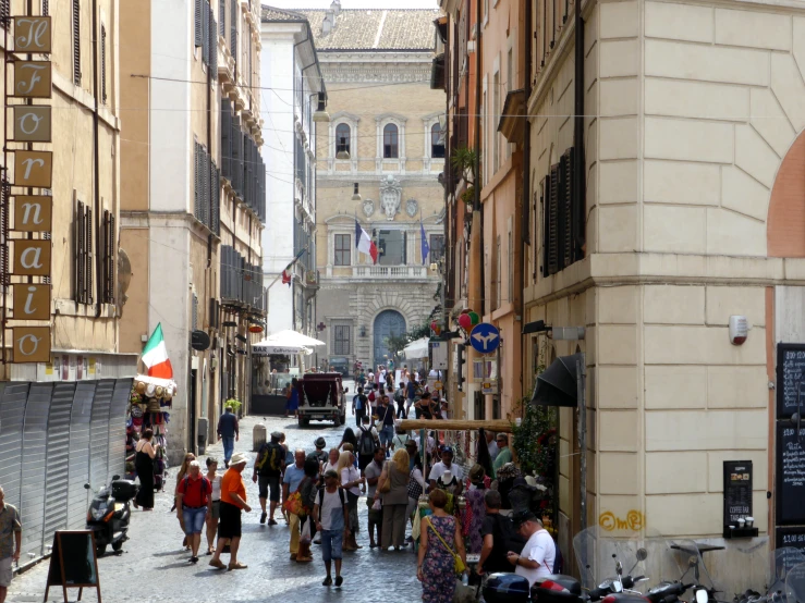 a city street with people walking down it