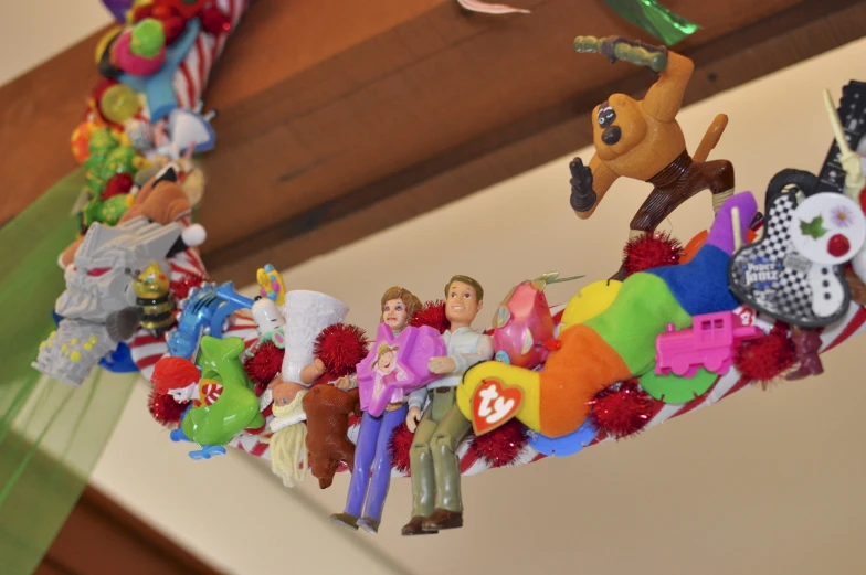 a number of toys are hanging up on the ceiling