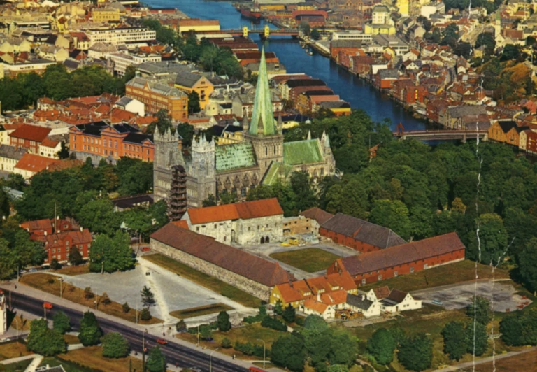 an aerial view of a city, with buildings around it