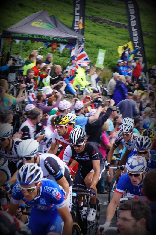 many people watching and cheering on a stage