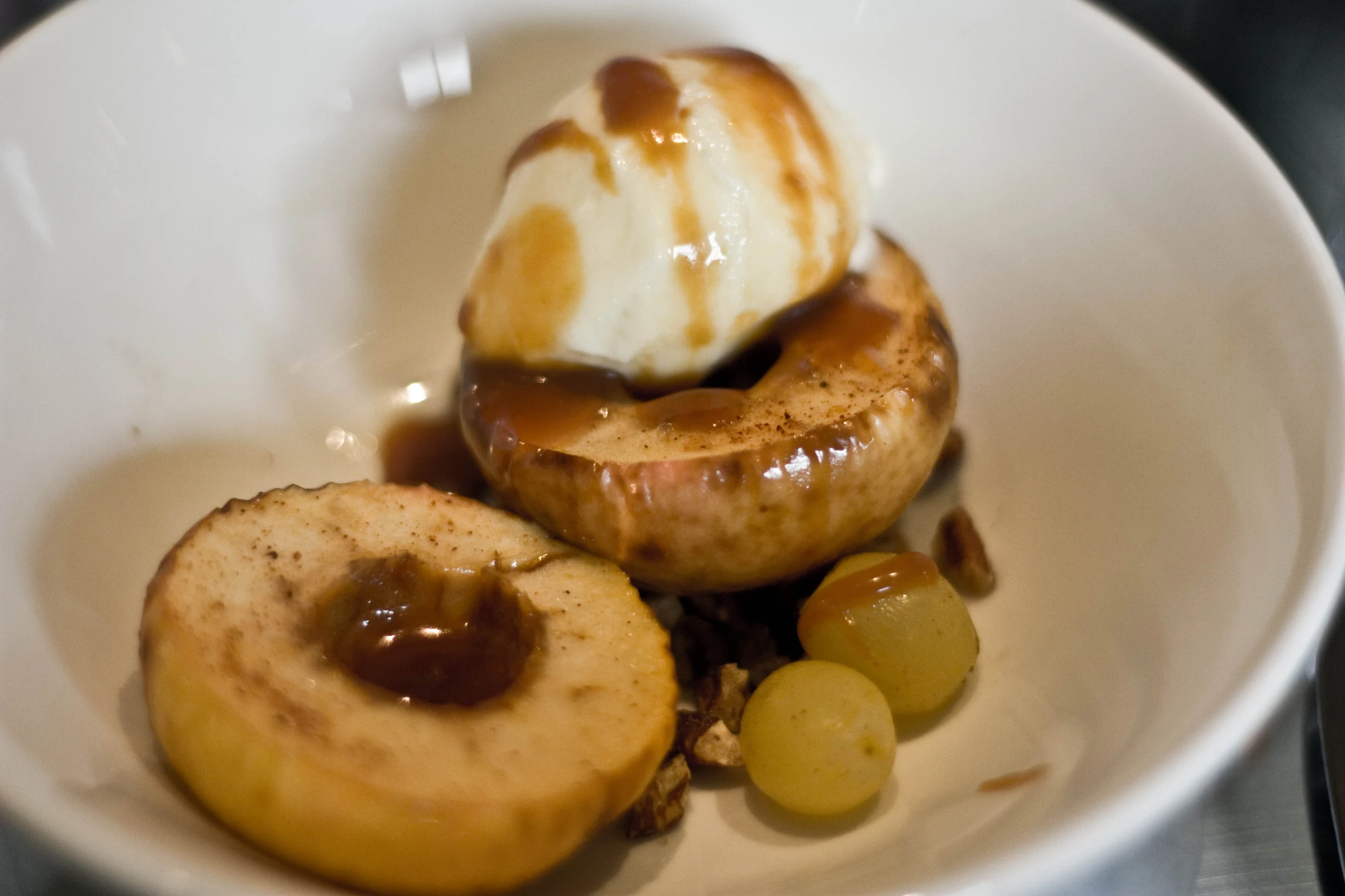 a plate with ice cream and some food on it