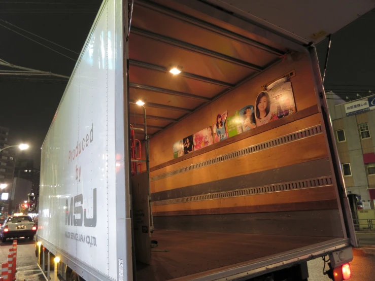 a large white truck with a lot of writing on the back