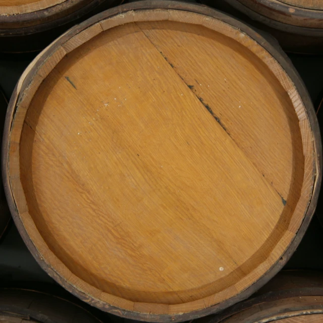 a close - up s of a wooden barrel stacked on a shelf