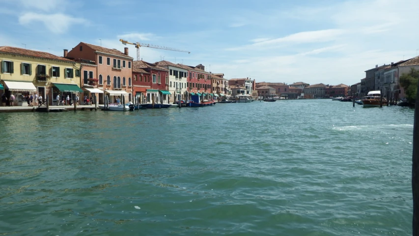 a view of a river that is full of buildings and boats