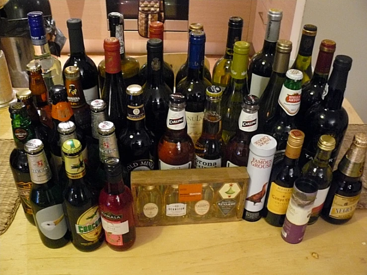 several different kinds of wine bottles on the counter