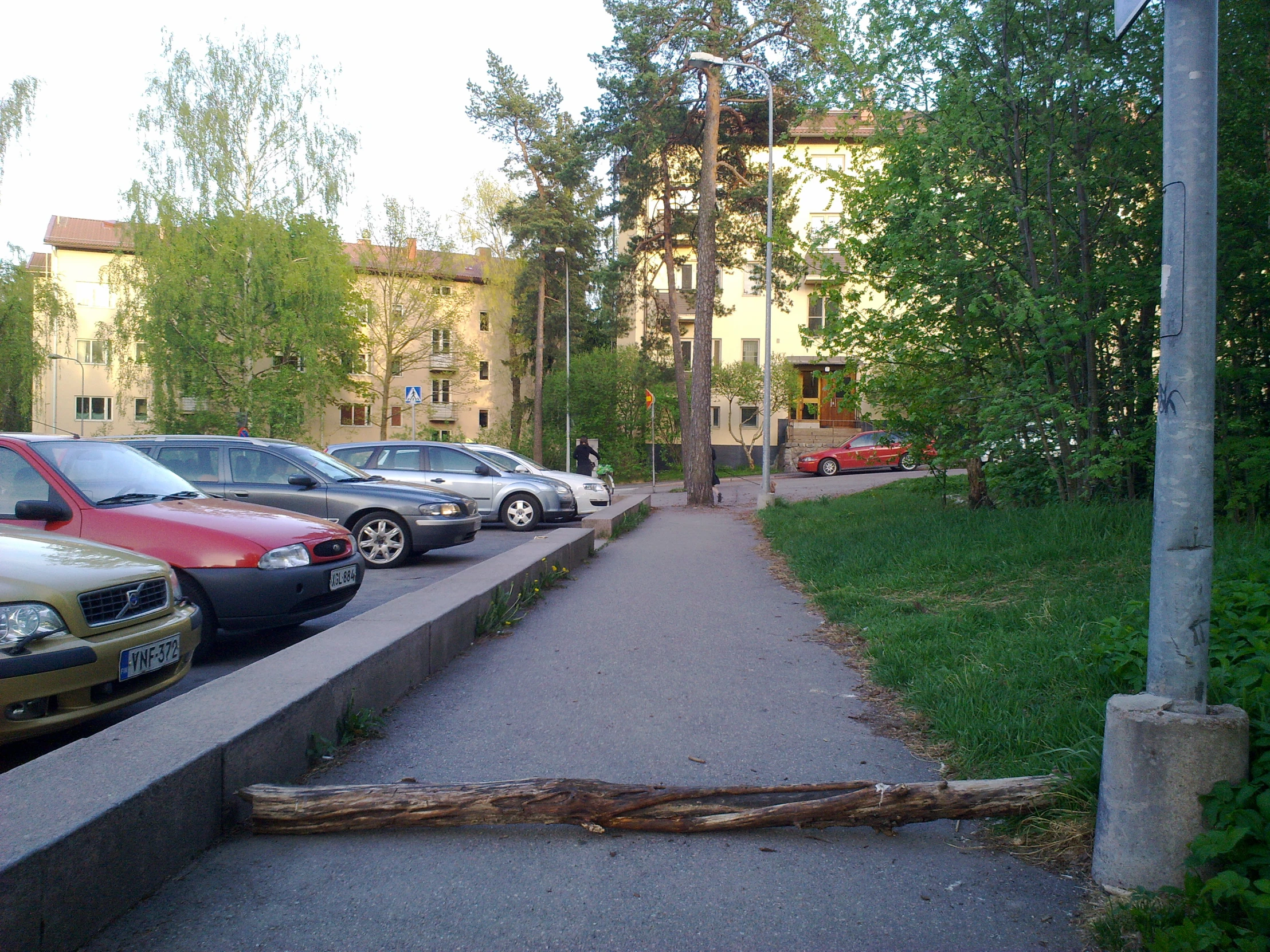 cars parked on the side of a street