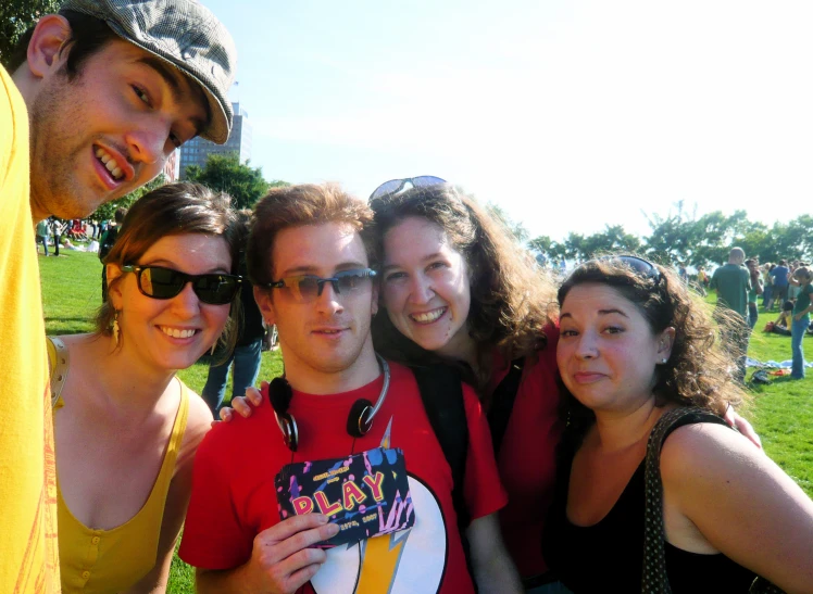 a couple people with sunglasses are posing for a picture