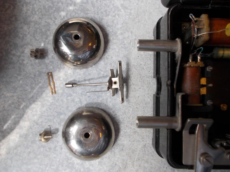 several small metal objects with one door latch
