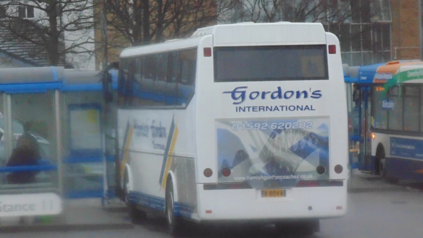 a couple of buses that are parked next to each other