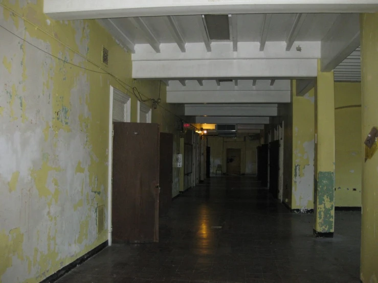 a corridor in an abandoned building that's being remodeled