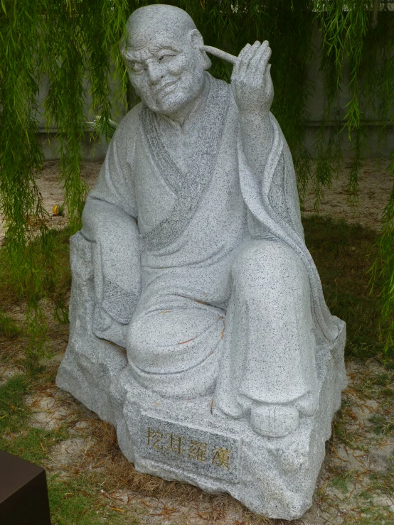 a statue of a man smoking a cigarette