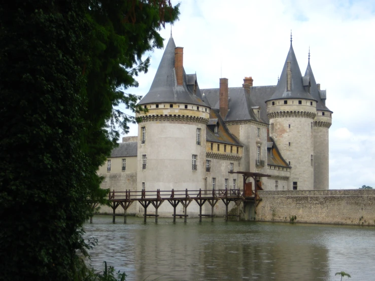 a castle sitting next to a large body of water