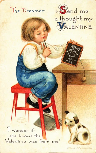 a child holding a chalkboard and kneeling down
