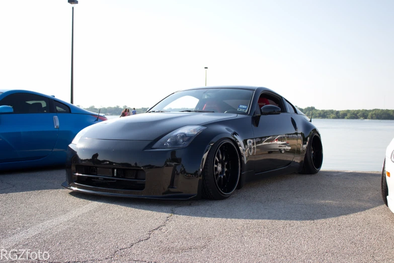 black car parked in front of other cars