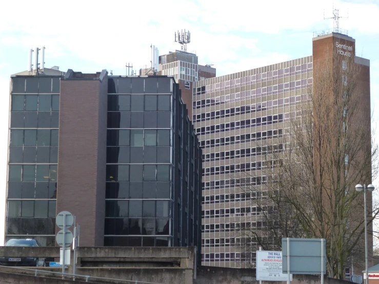 a row of very tall buildings in the middle of a town