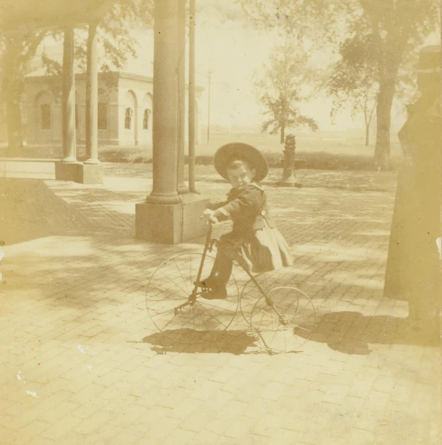 a person riding a bike on top of a stone ground