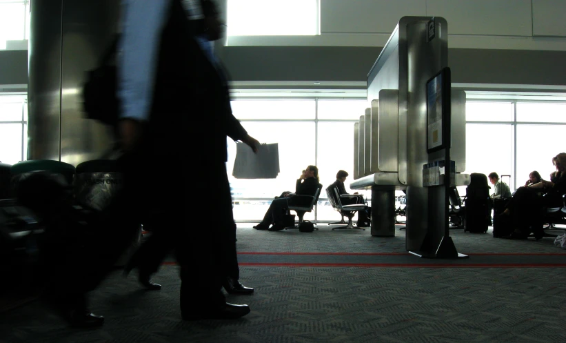 people are waiting for their flight at the airport